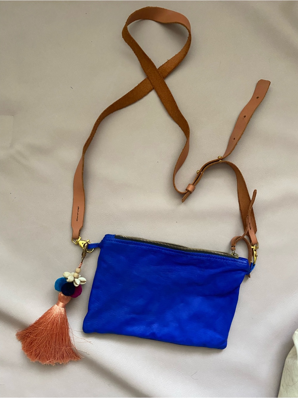 Noonday Cobalt Blue Leather Crossbody Bag with Tan Strap and Tassel